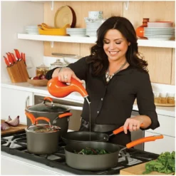 Rachael Ray Hard Anodized II Cookware Set W/ Orange Handles: 10pc -Le Creuset sales rachael ray evoo bottles in use kitchen setting compressed 6 1